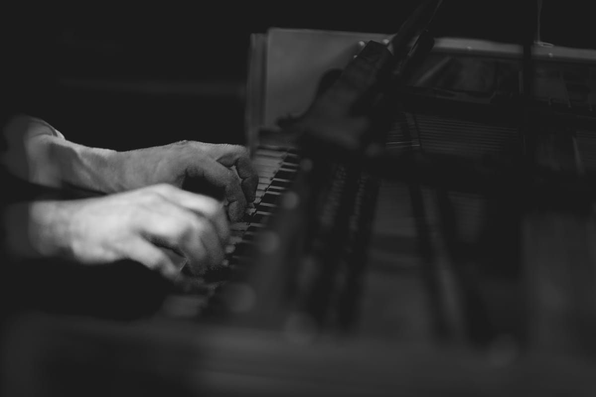 Pablo Devigo’s hands playing a harpsichord during the recording session of Still Life